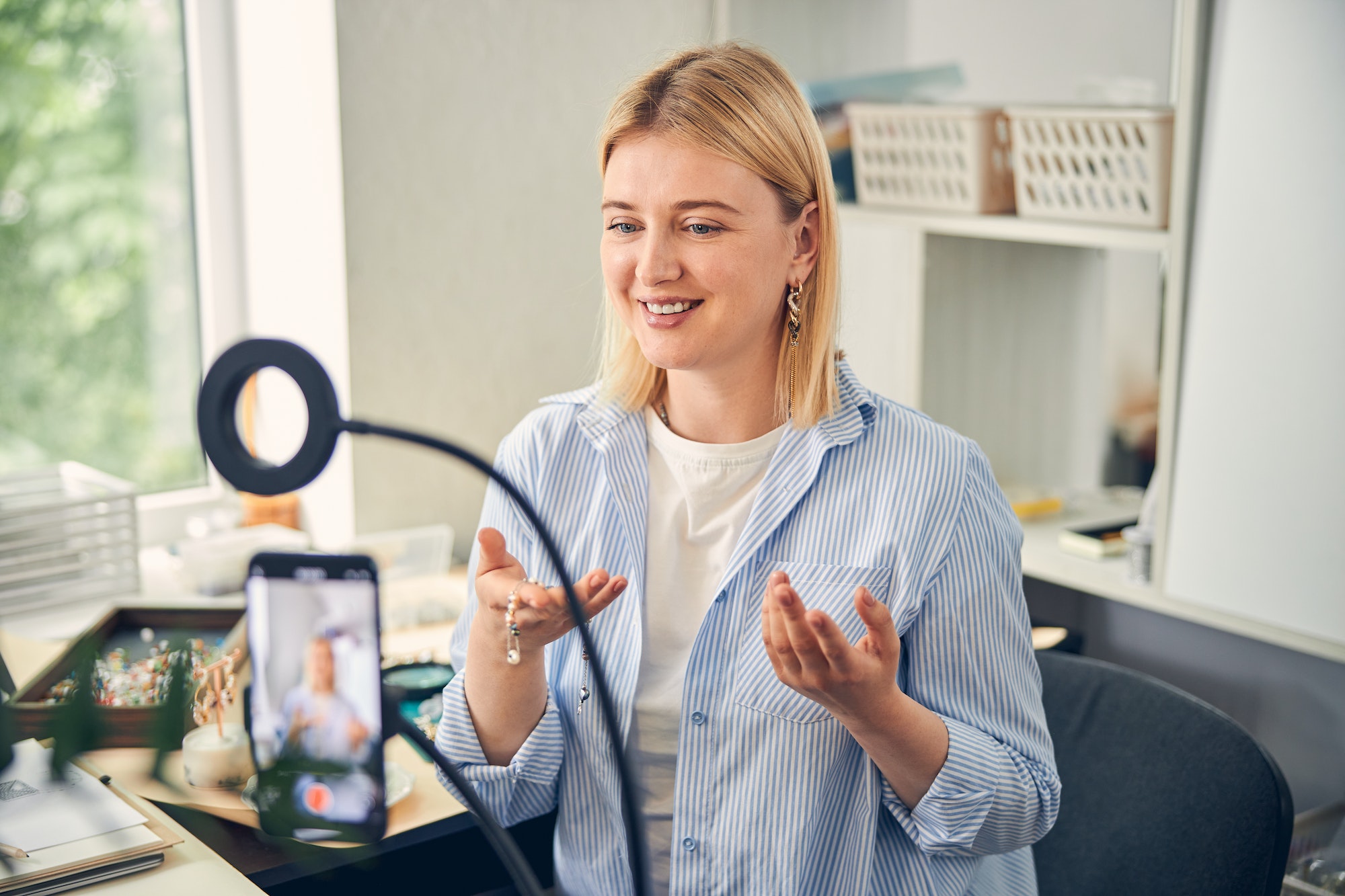 pleased-woman-making-a-video-about-jewelry-production.jpg